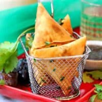 Keema samosas in a small fryer basket