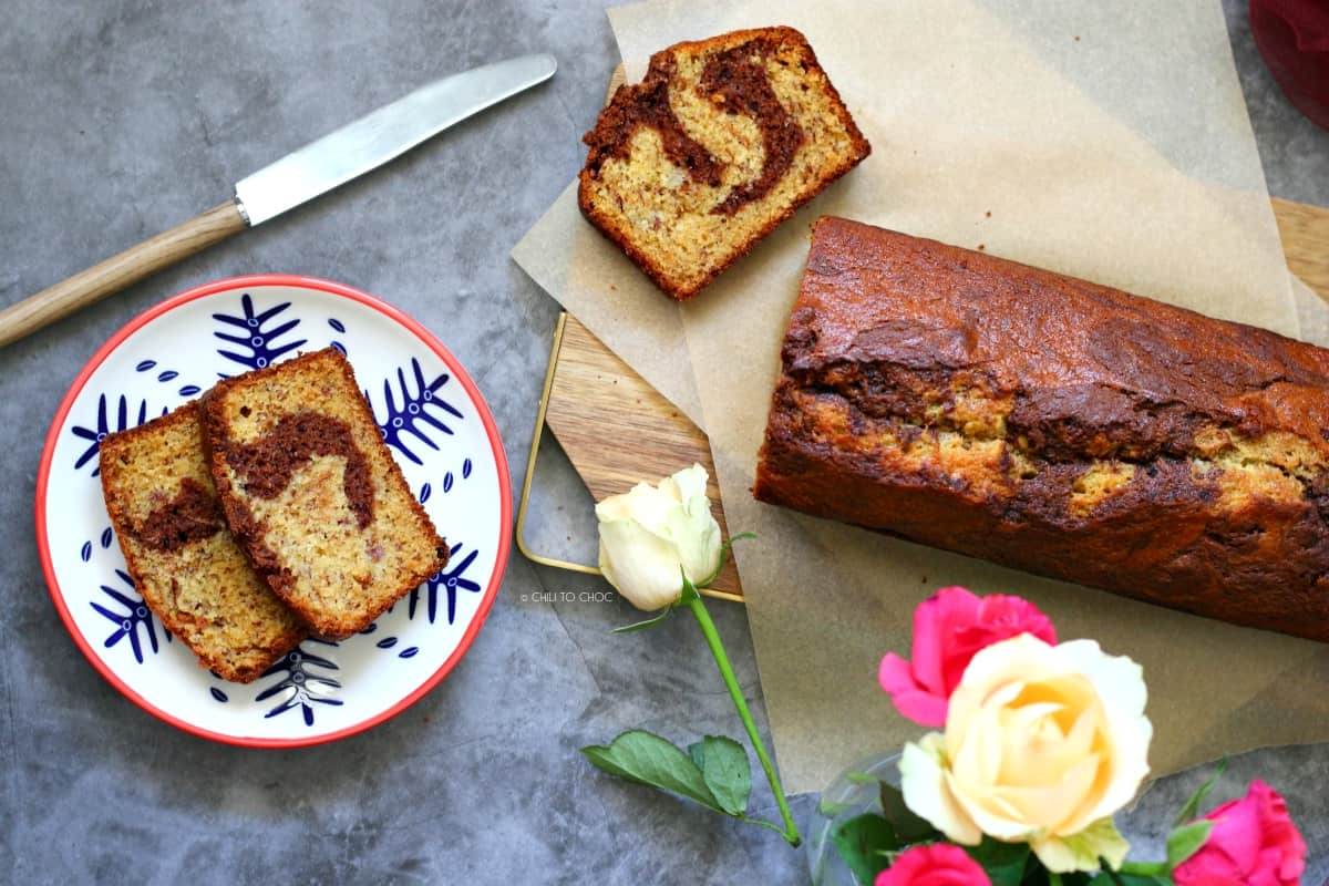 Sliced Chocolate Marbled Banana Bread on a wooden board