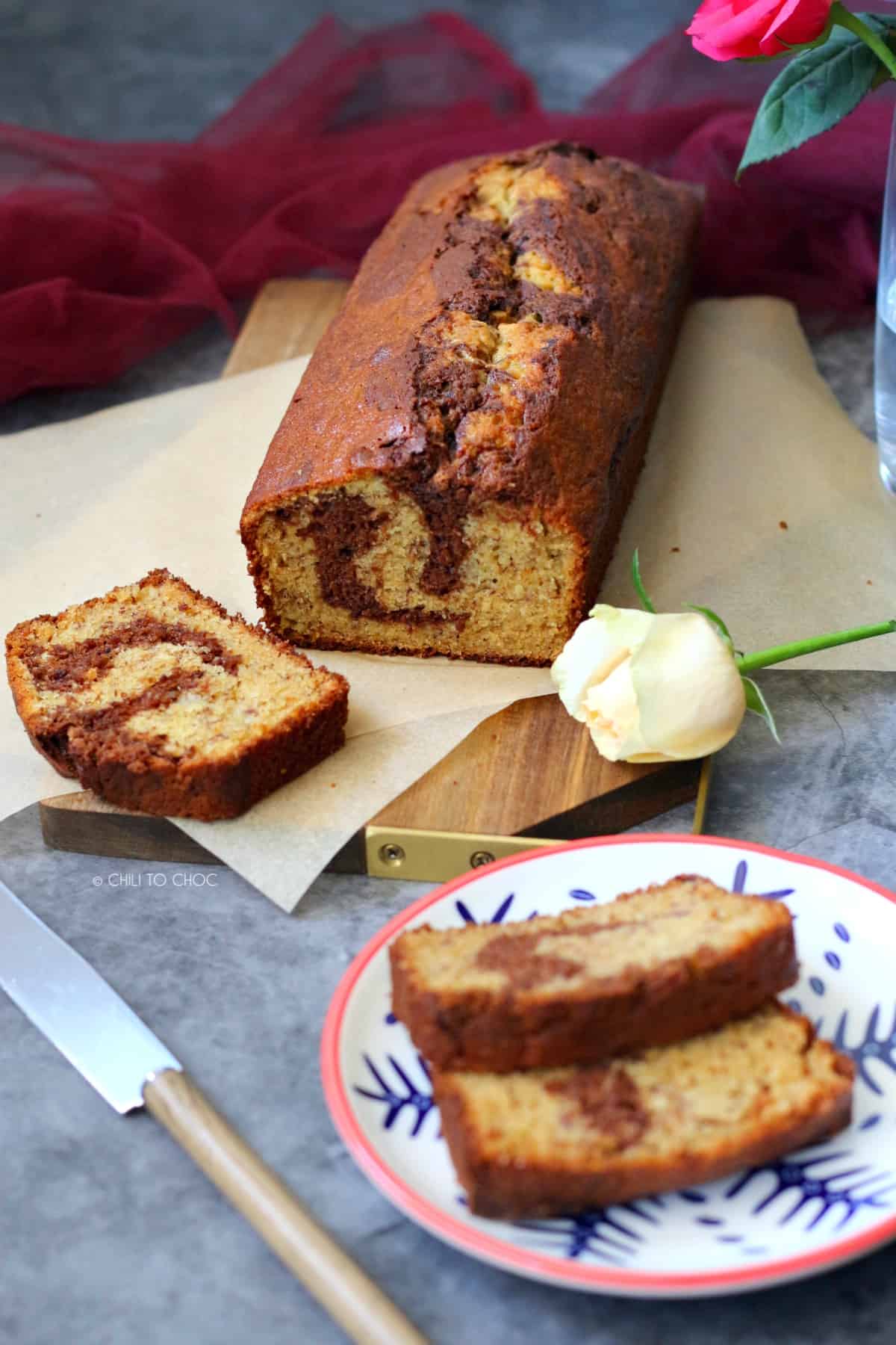 Sliced Chocolate Marbled Banana Bread on a wooden board