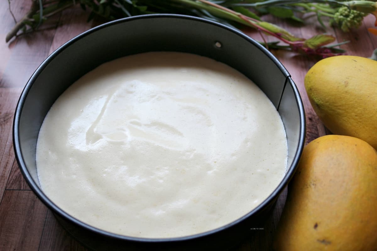 sponge cake batter with mangoes on the side