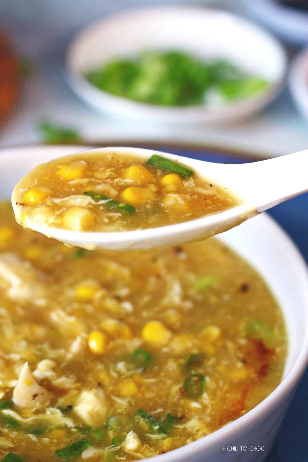 A spoonful of chicken corn soup.