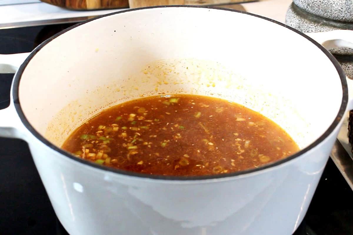 Soup broth in a Dutch pot.