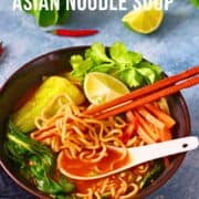 Pinterest graphic for Asian noodle soup with toppings in a brown bowl.