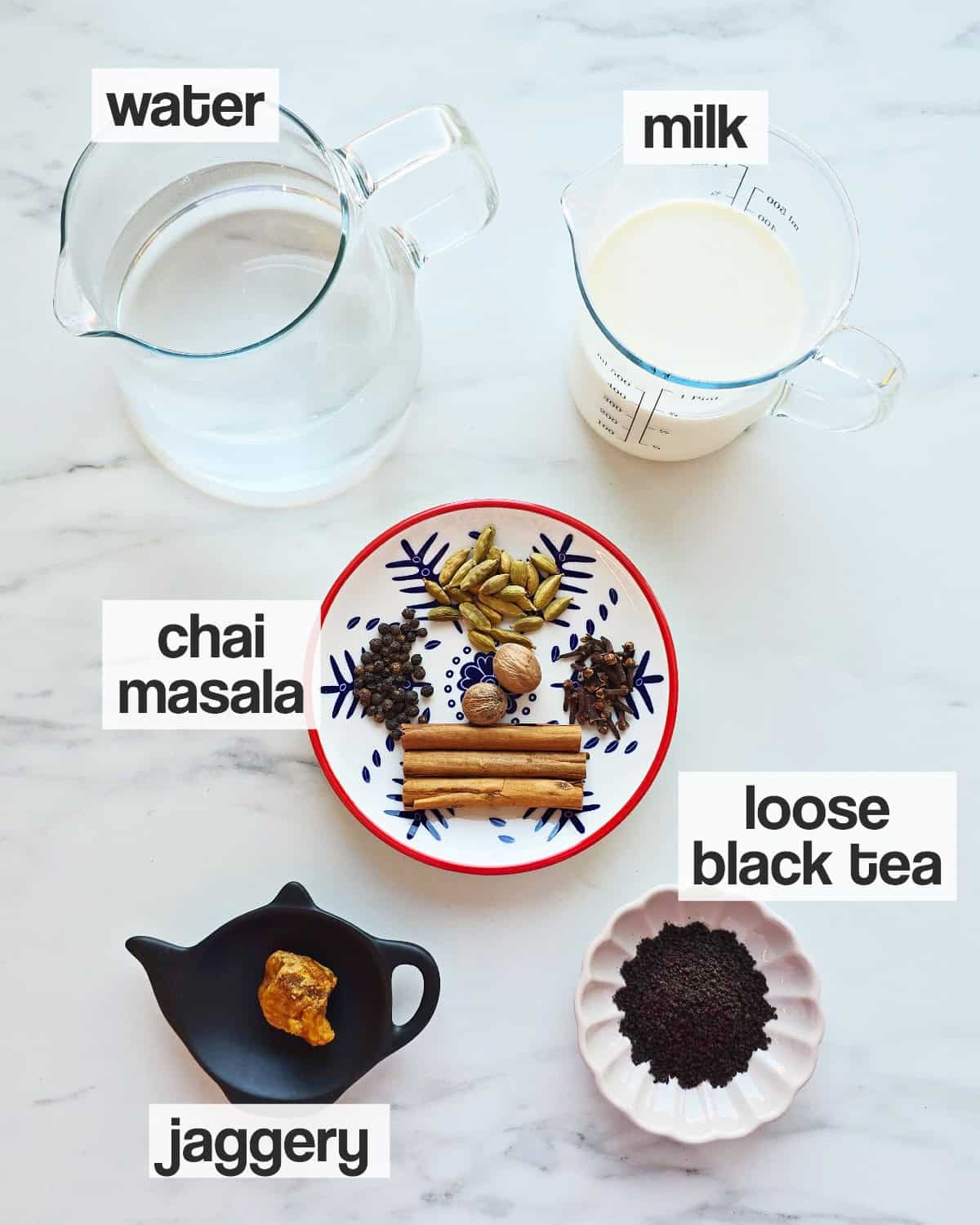 Labeled ingredients for making masala chai.