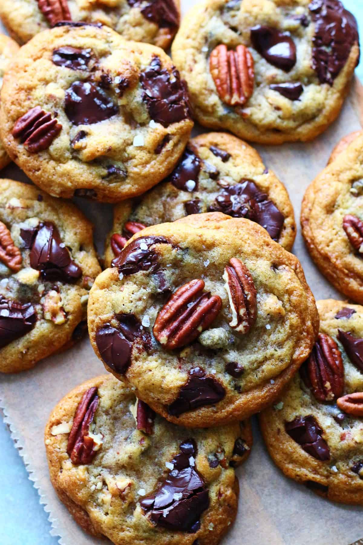 Close up of chocolate chip pecan cookies with sprinkled sea salt.