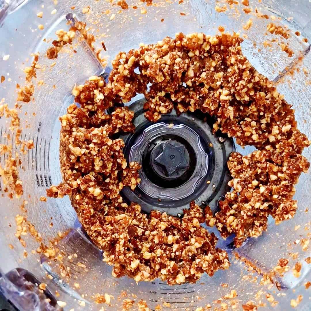 Chopped date and nuts mixture in a food processor.