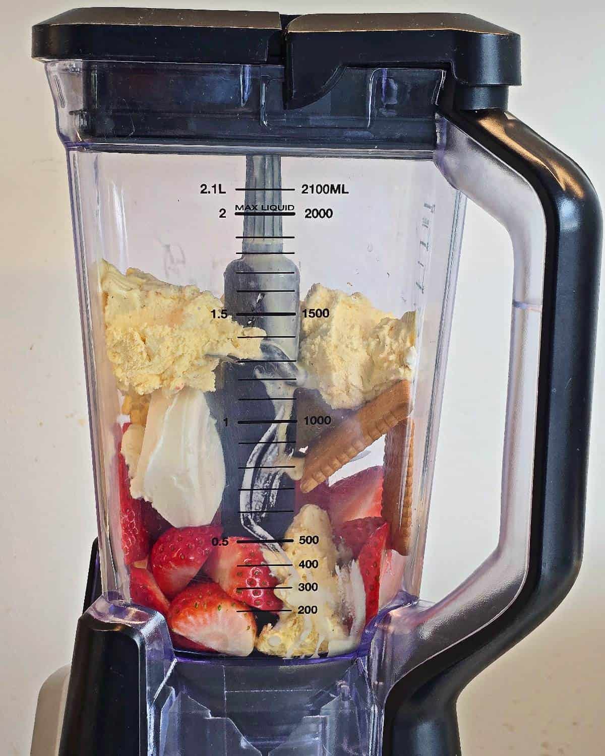 Strawberries, crackers, ice cream and cream cheese in a blender.